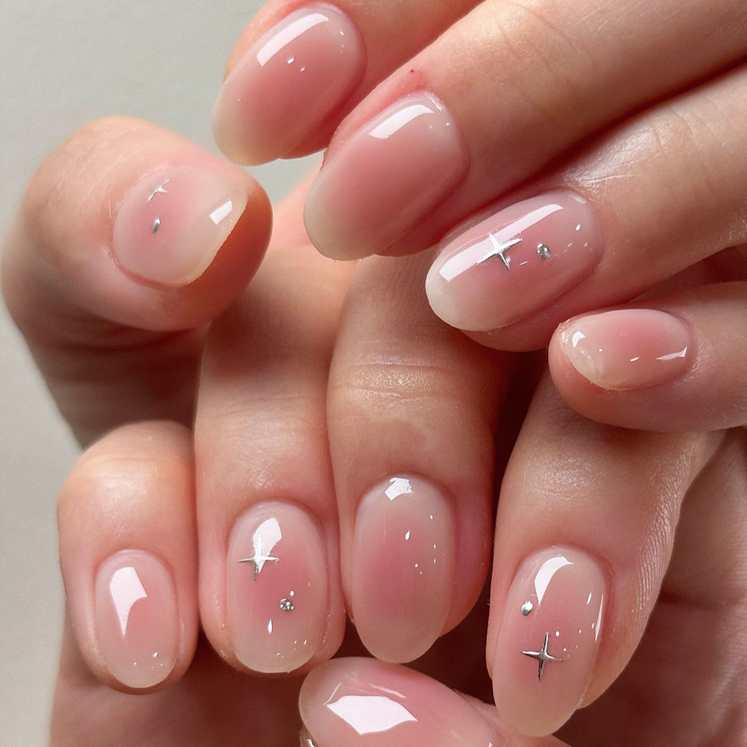 Elegant Glossy Nail Tips with Subtle Star Accents Kalsten