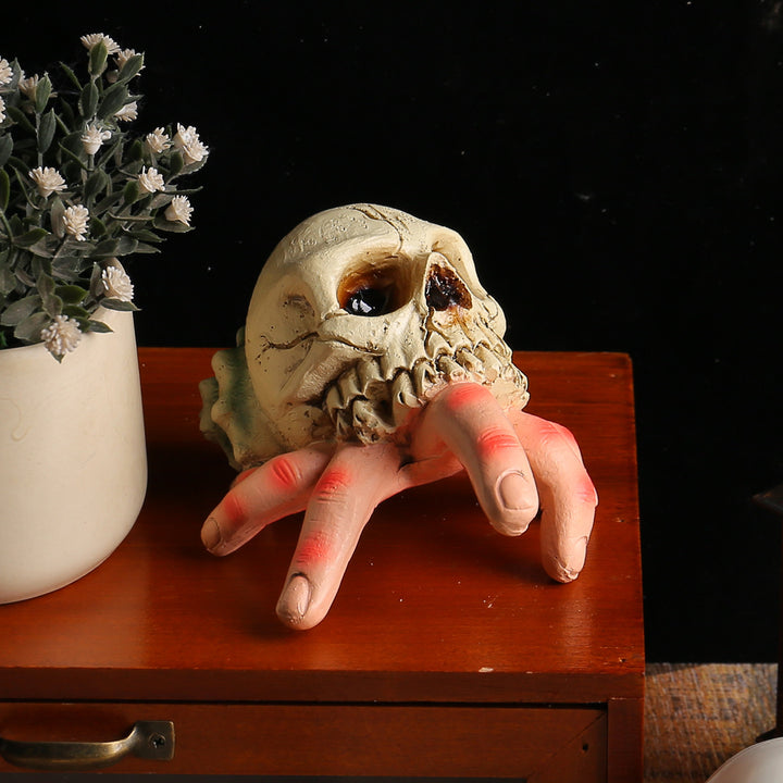 Detailed Halloween decoration sculpture skull with grasping hand