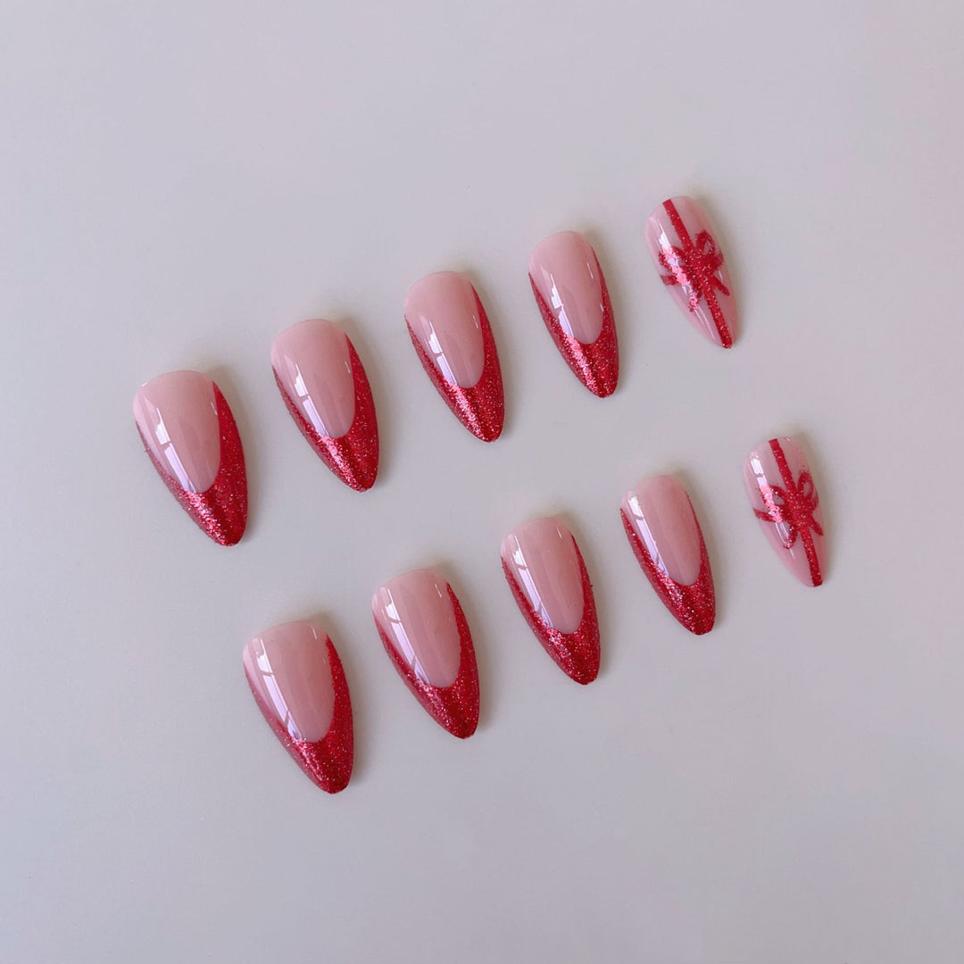 Nail set with glamorous glitter accents and bow design Kalsten
