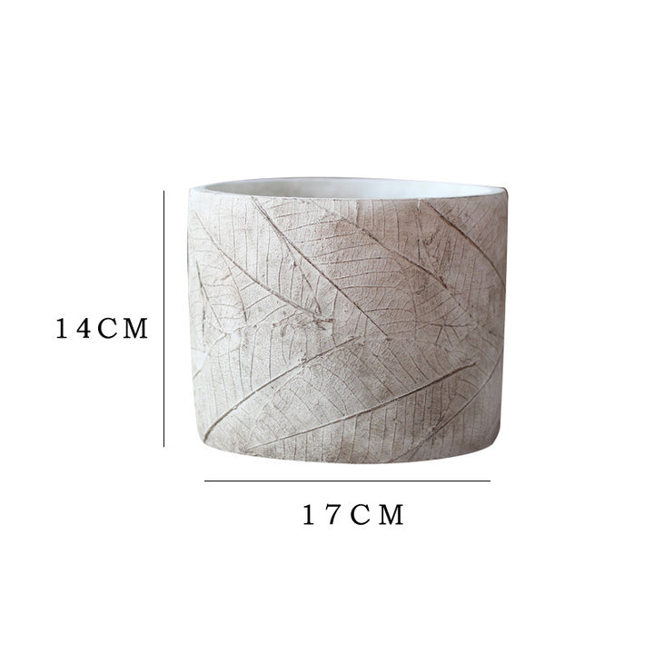 Decorative plant container made of handmade ceramic with leaf pattern Kalsten