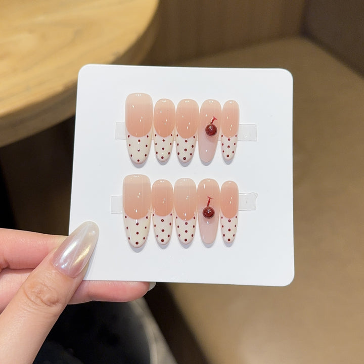 Artificial nails with playful design and cherry accents Kalsten