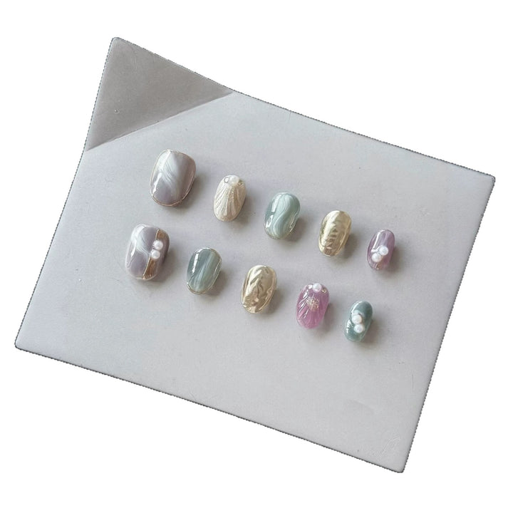 Artistic Press-On Nail Set with Natural Marble Designs