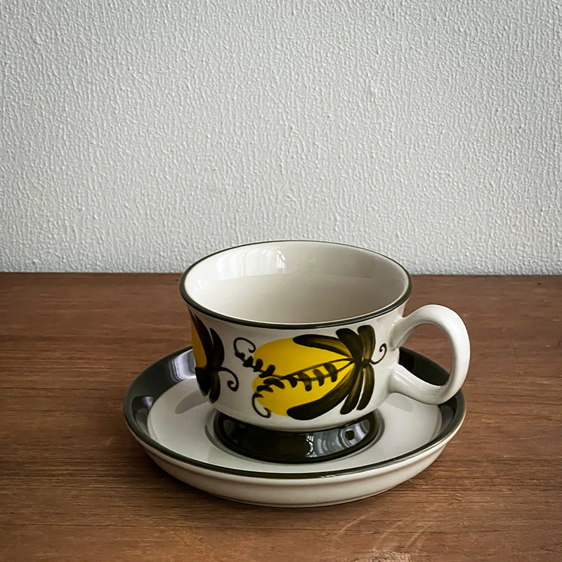 Ceramic coffee cup set with saucer and hand-painted leaf ornament