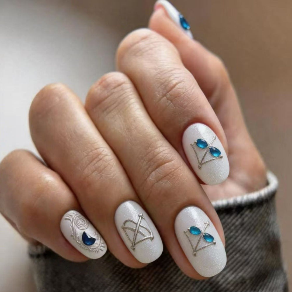 Artificial nails with noble glitter accents and symbol motif Kalsten
