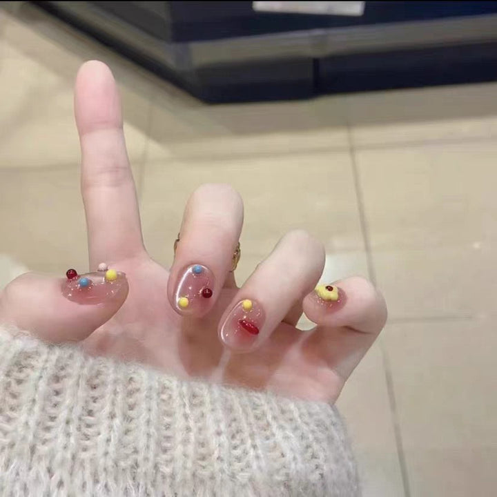 Artificial nails with playful decor Kalsten