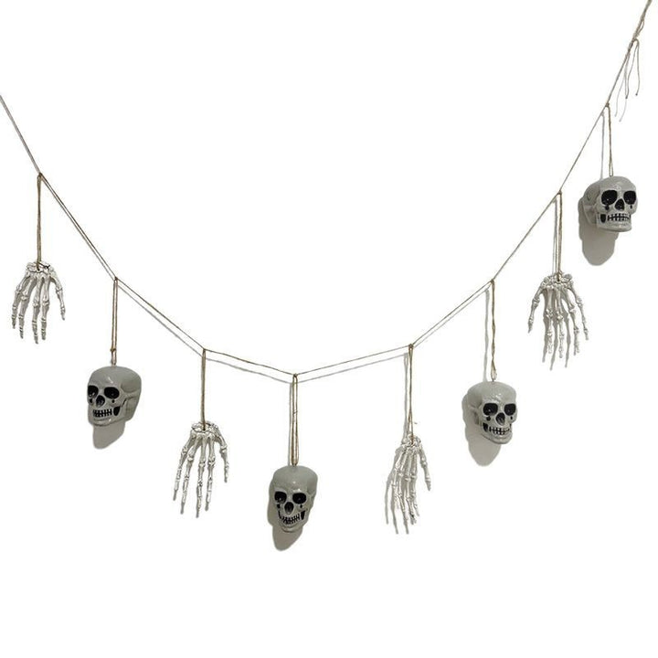Decorative garland with skeleton hands