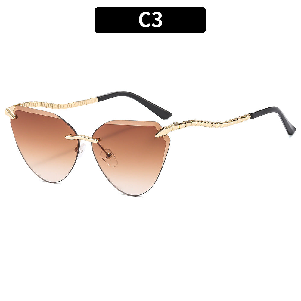 Sculptural Cat-Eye Sunglasses with Decorative Gold Accents