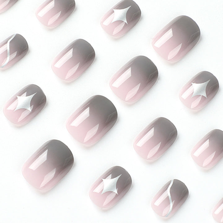 Artificial nail art with elegant ombre design and charming accents Kalsten