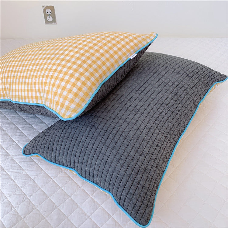 Reversible quilted pillow set with checked cotton cover and contrasting piping