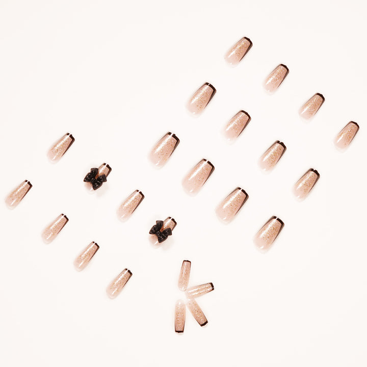Artistic Nail Extensions with Glitter and Bow Accents Kalsten
