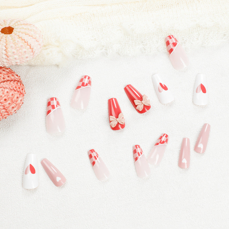 Artful nail extensions with playful designs and romantic accents Kalsten