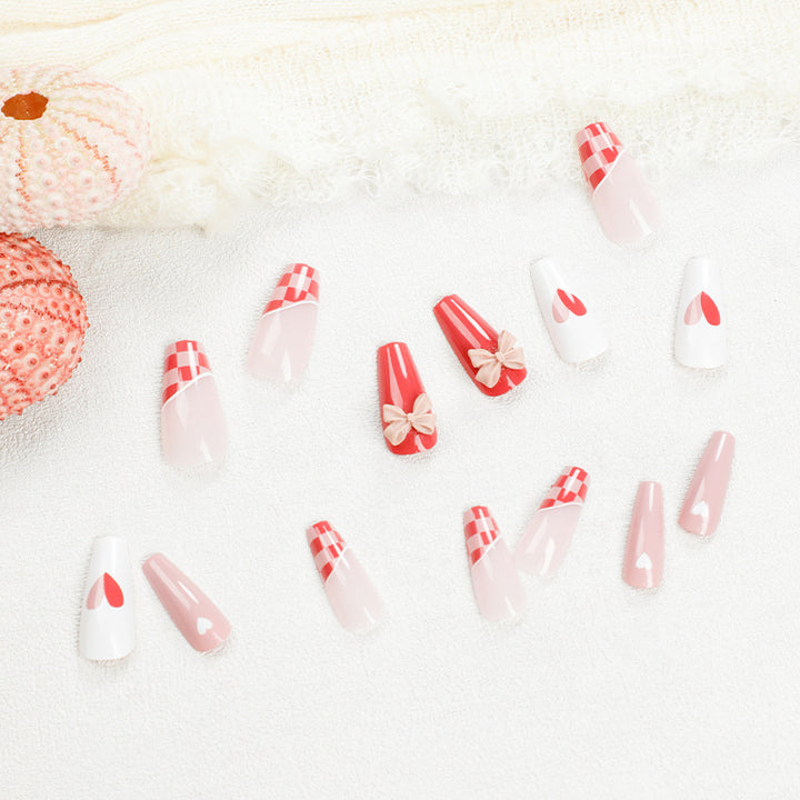 Artful nail extensions with playful designs and romantic accents Kalsten