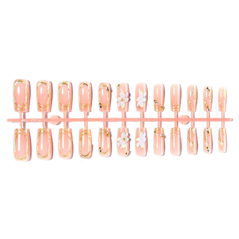 Artificial nail set with floral embellishments and gold accents Kalsten