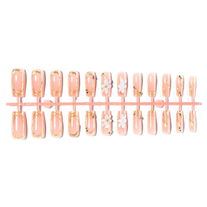 Artificial nail set with floral embellishments and gold accents Kalsten