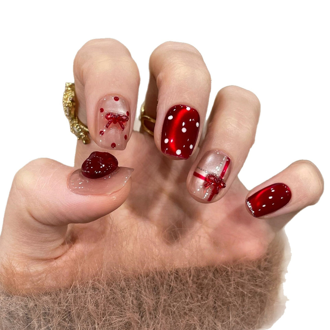 Artificial nails with festive gift design Kalsten