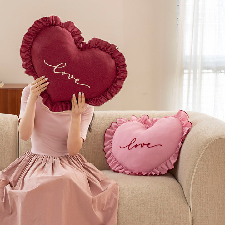 Heart-shaped decorative cushion with ruffles and embroidered text Kalsten