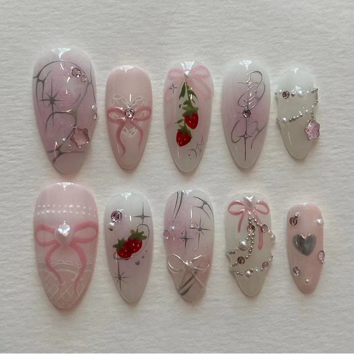 Artificial nail art with romantic design and glitter accents Kalsten