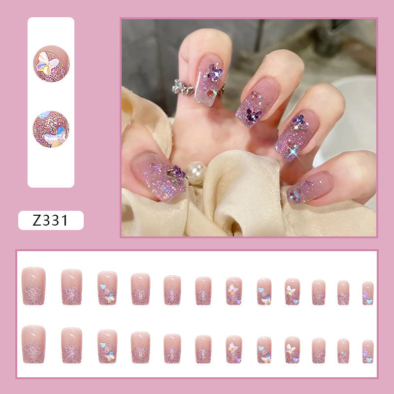 Glamorous artificial nails with glitter and floral accents Kalsten