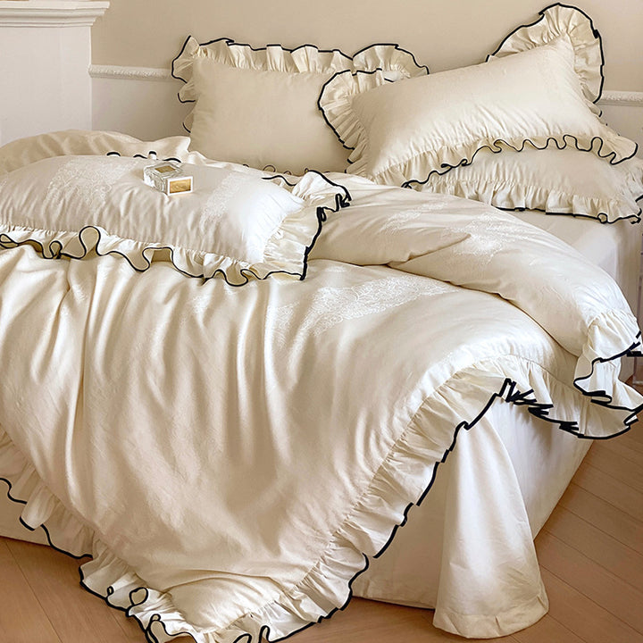 Noble cotton satin bedding set with flounce ruffles, jacquard floral border and contrasting piping.