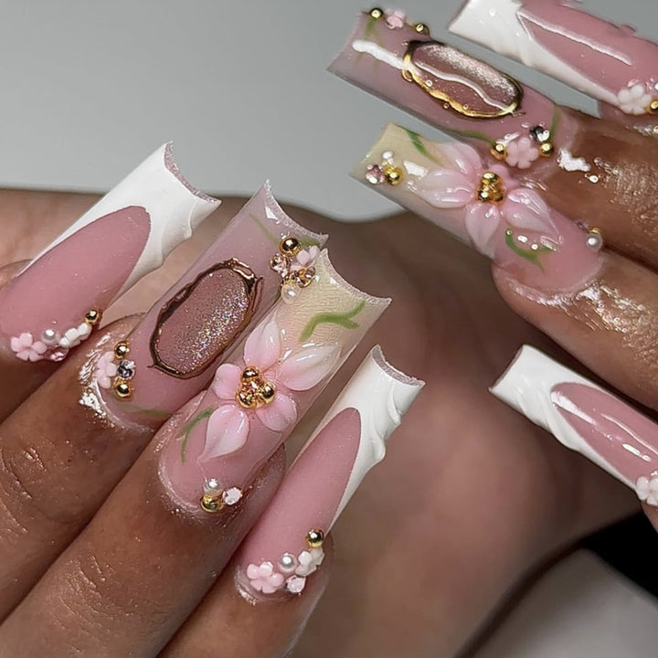 Artful nail extensions with floral embellishments Kalsten
