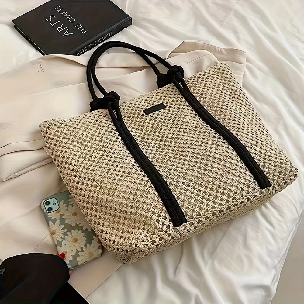 Beach bag made of hand-woven natural material with sturdy handles Kalsten
