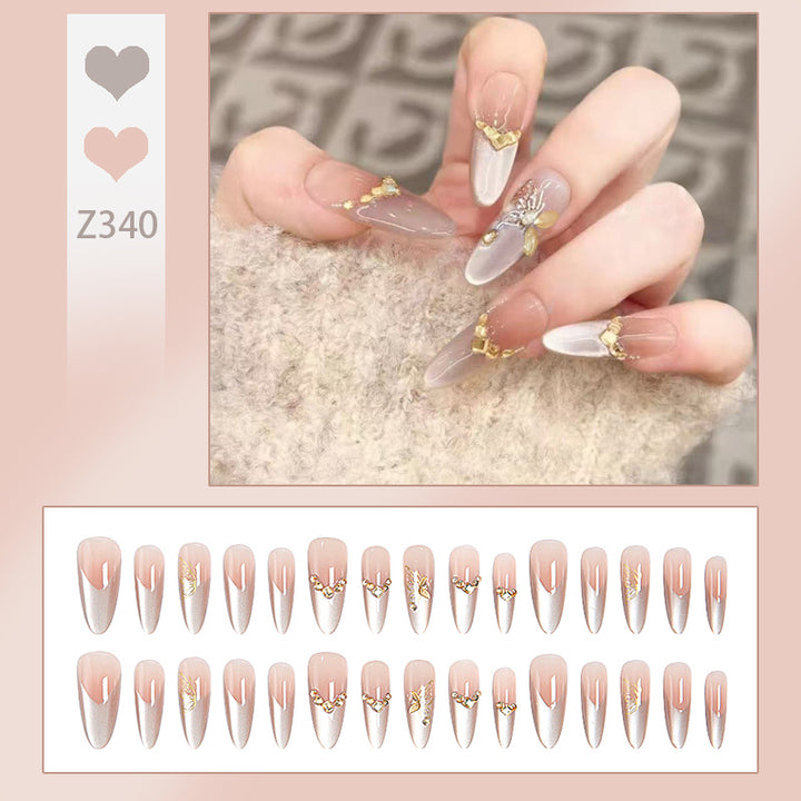 Glamorous art nails with elegant golden details Kalsten