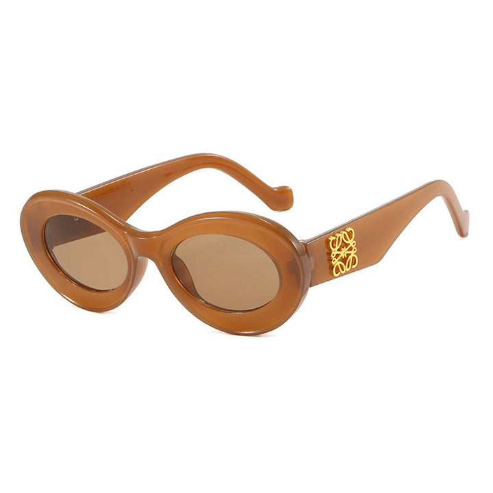 Women's fashionable sunglasses with oval frame and golden accents Kalsten