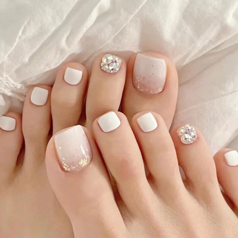 Artful toenail design with sparkling embellishments Kalsten