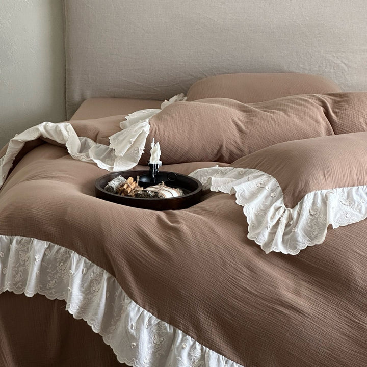 Quilted cotton duvet with embroidered frill and layered ruffled bed skirt
