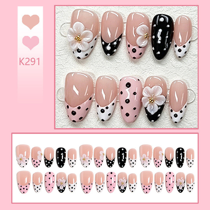 Nail art set with floral accents and elegant dots Kalsten