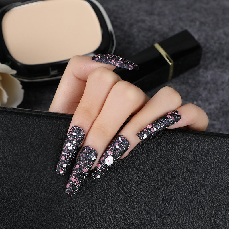 Artistic splatter design artificial nails Kalsten