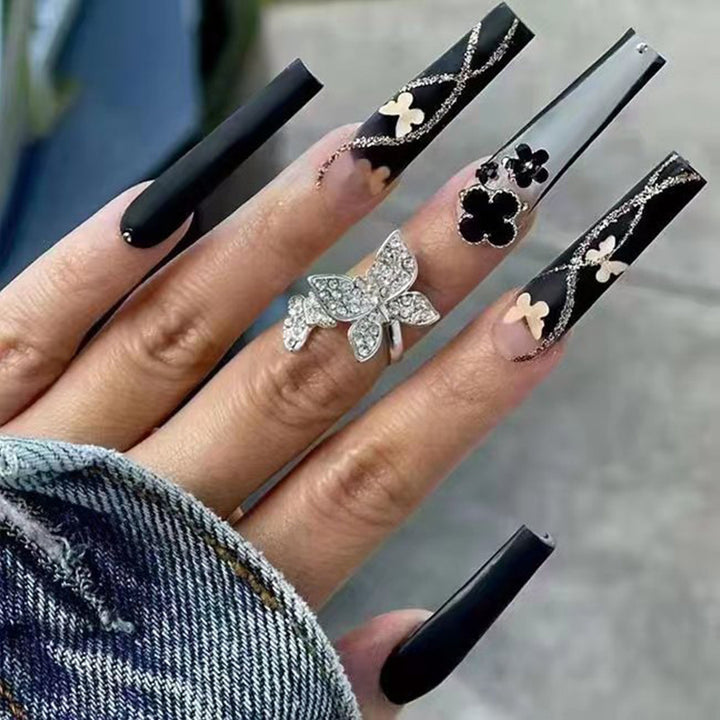 Art nail set with elegant butterfly and flower motifs Kalsten