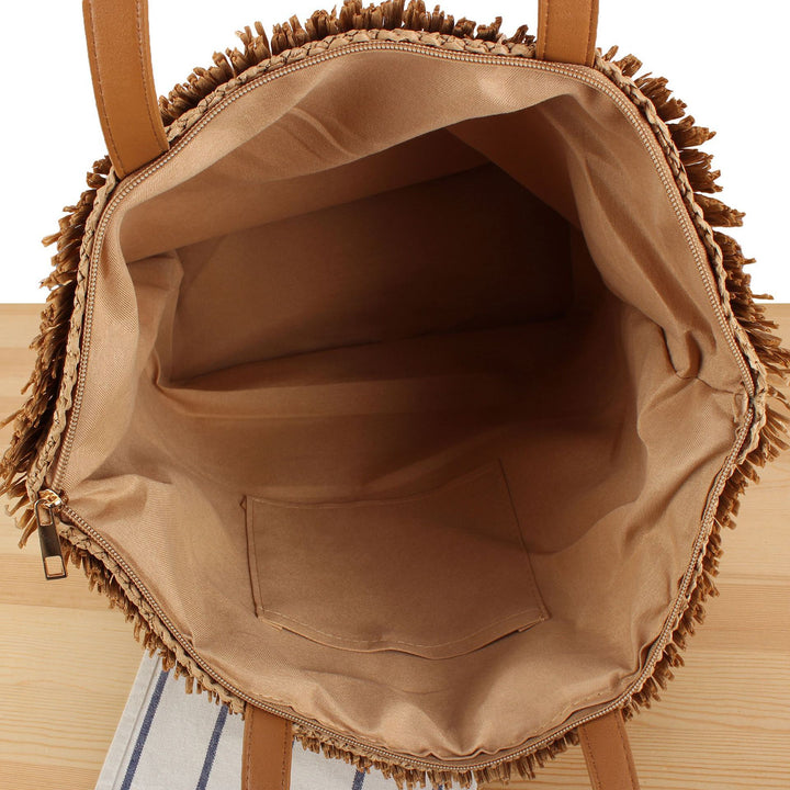 Beach bag made of handwoven natural material with fringe decoration Kalsten