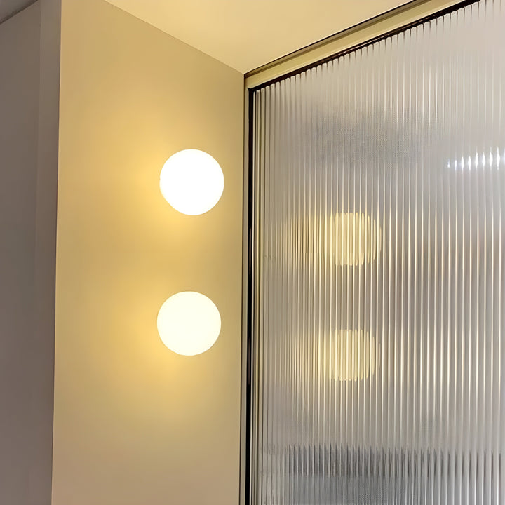 GlasAura Wall Lamp with Matte Glass Ball and Metal Base | Kalsten