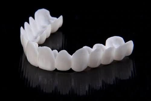 Kalsten | Dental prosthesis with white dental lenses