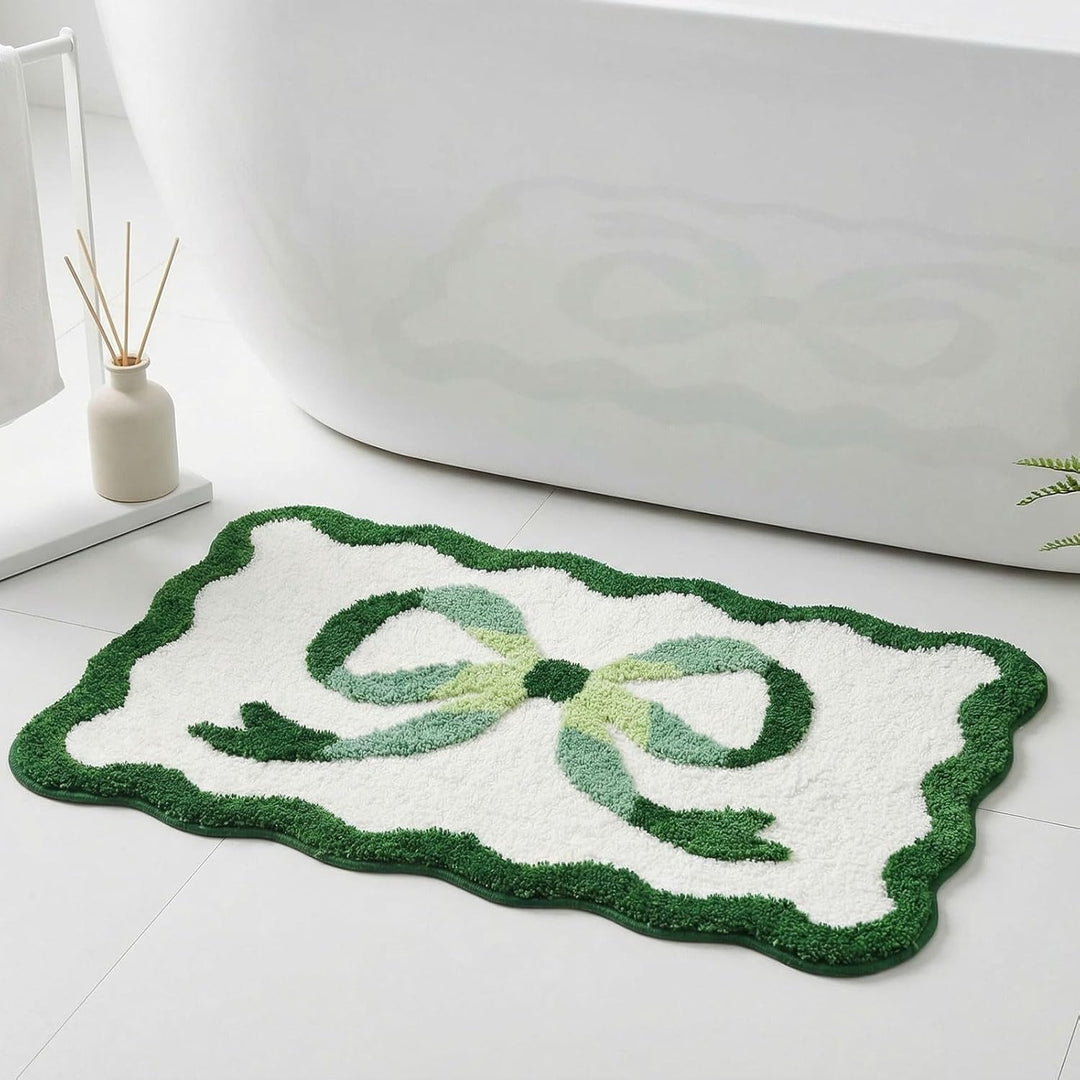 Bath mat with bow motif, synthetic fiber fabric