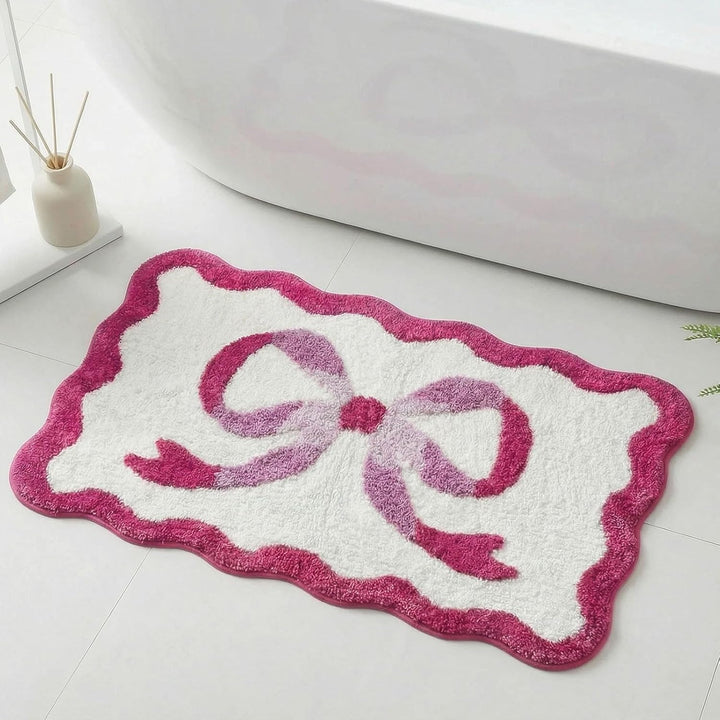 Bath mat with bow motif, synthetic fiber fabric