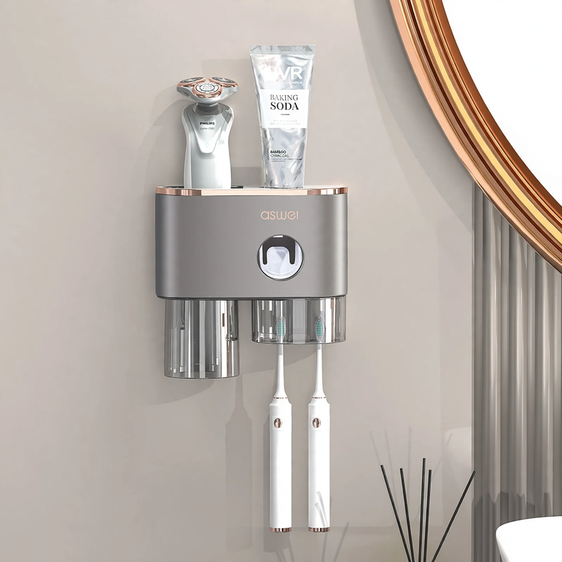 Toothbrush wall holder with toothpaste squeezer