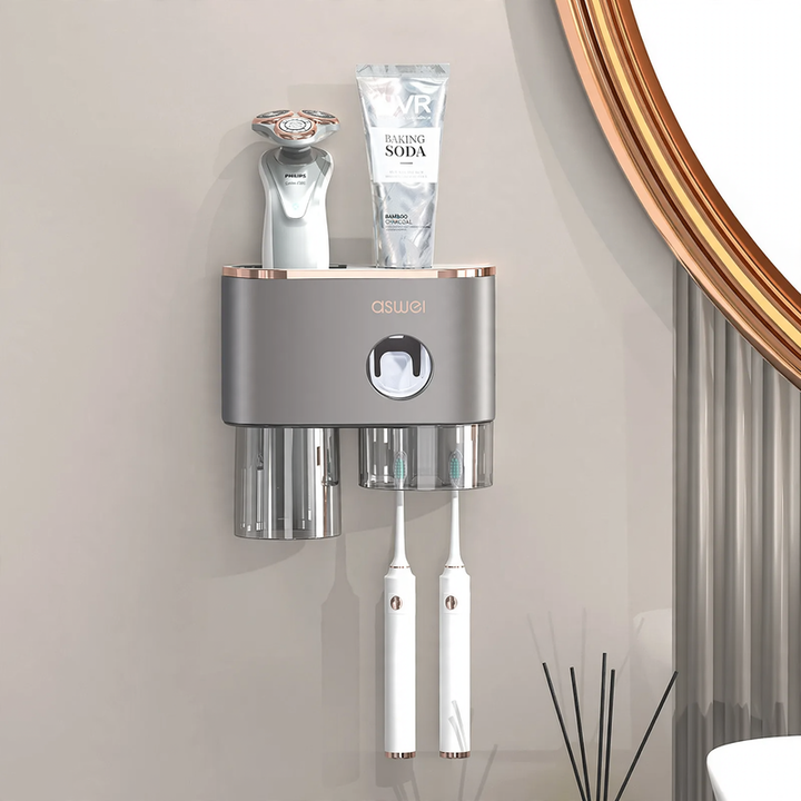 Toothbrush wall holder with toothpaste squeezer