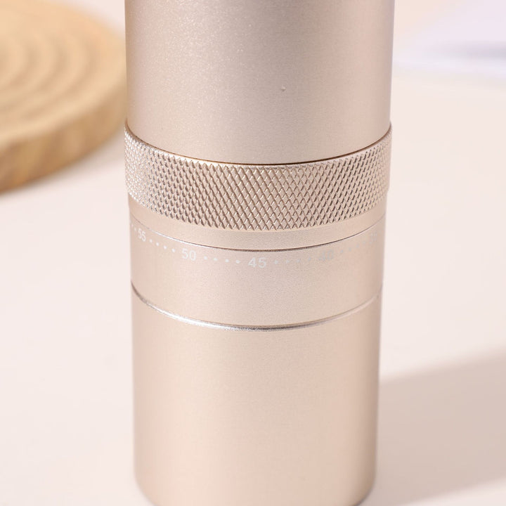 Hand coffee grinder with CNC grinding mechanism and brush