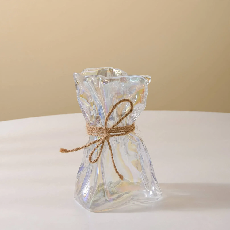 Glass vase with irregular folding pattern