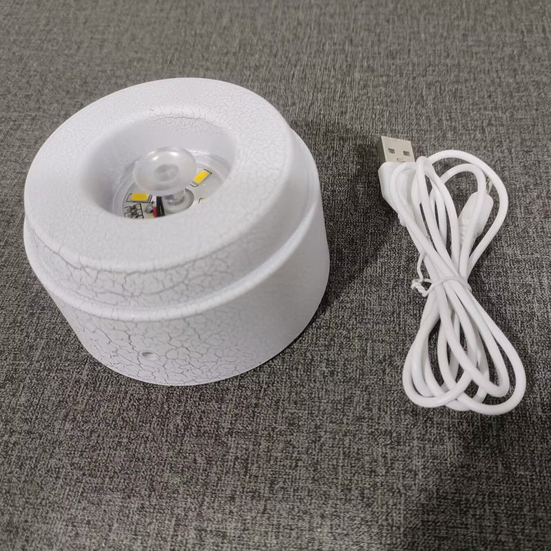 Glowing crystal ball with rotating base
