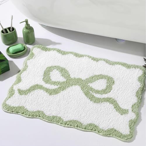 Bath mat with bow motif, synthetic fiber fabric