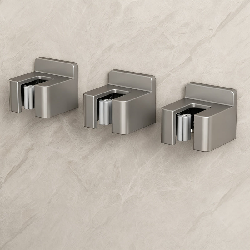 Stainless steel wall holder for brooms and mops