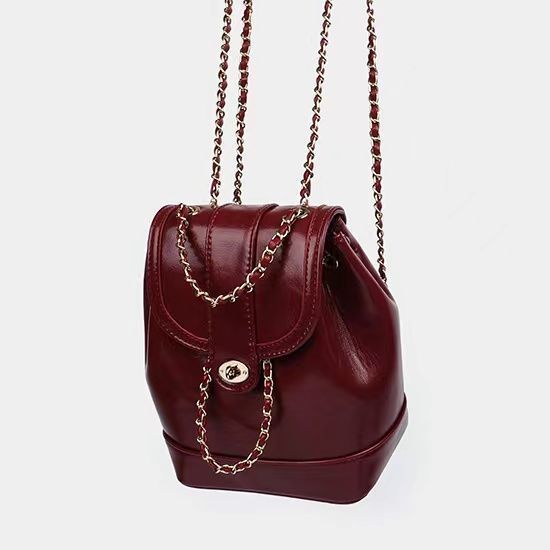 Compact backpack made of PU with chain decoration