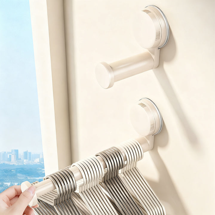 Telescopic clothes rail with suction cup