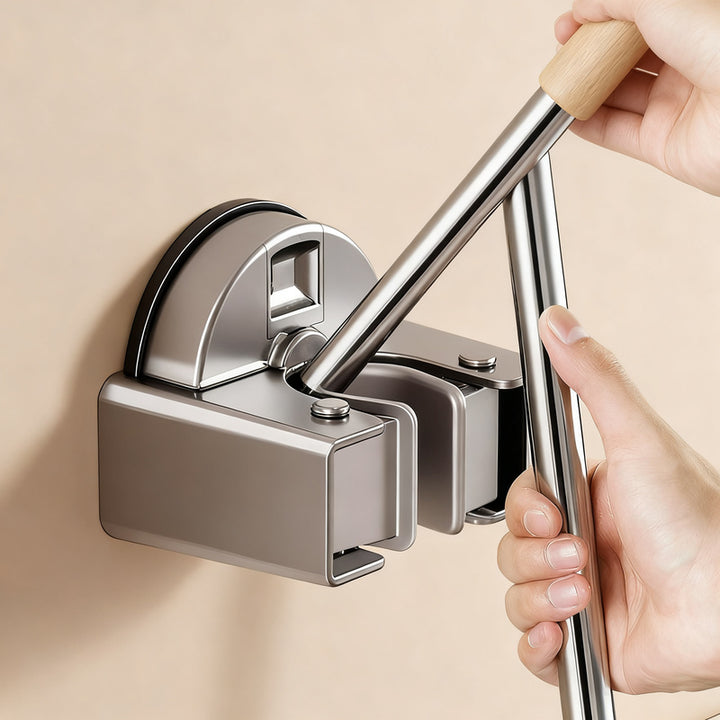 Suction cup holder for brooms and mops
