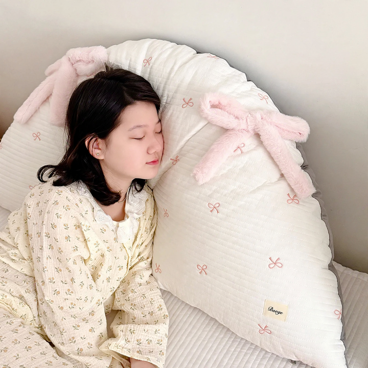 Cotton pillow with bow pattern