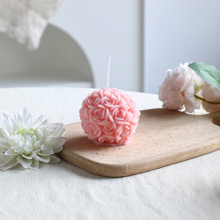 Rose-colored scented candle made from soy wax, handcrafted