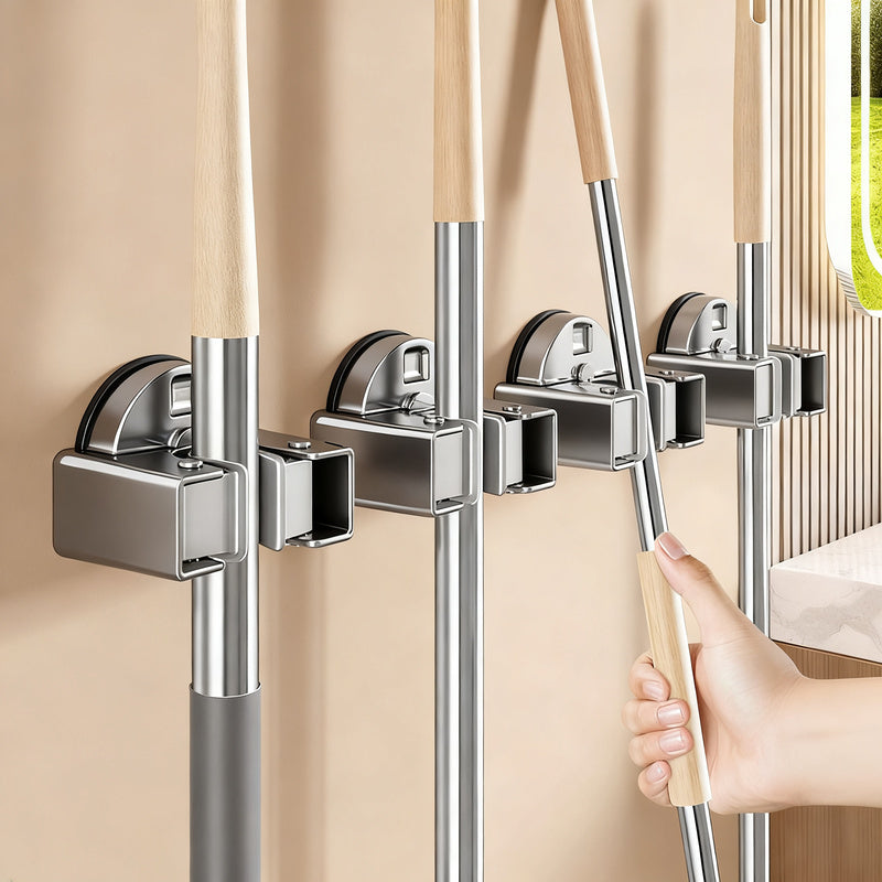 Suction cup holder for brooms and mops